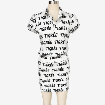 White dress with black text on a mannequin against a white background